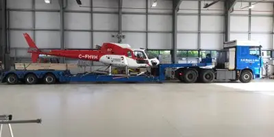 Super Yacht Helicopter awaiting delivery airside in Suffolk Airport.